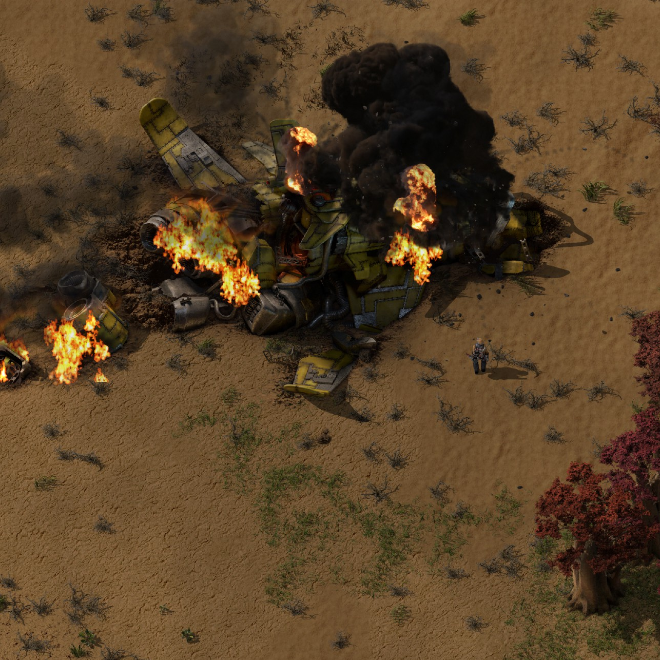 In the game Factorio, a yellow spacecraft has crash-landed in a barren desert. The wreckage is broken apart and on fire, with thick smoke billowing upward. The armored player character stands a short distance away, facing the burning debris.